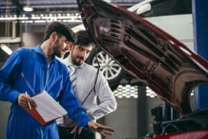 Automotive maintenance mechanic explain repair condition to customer